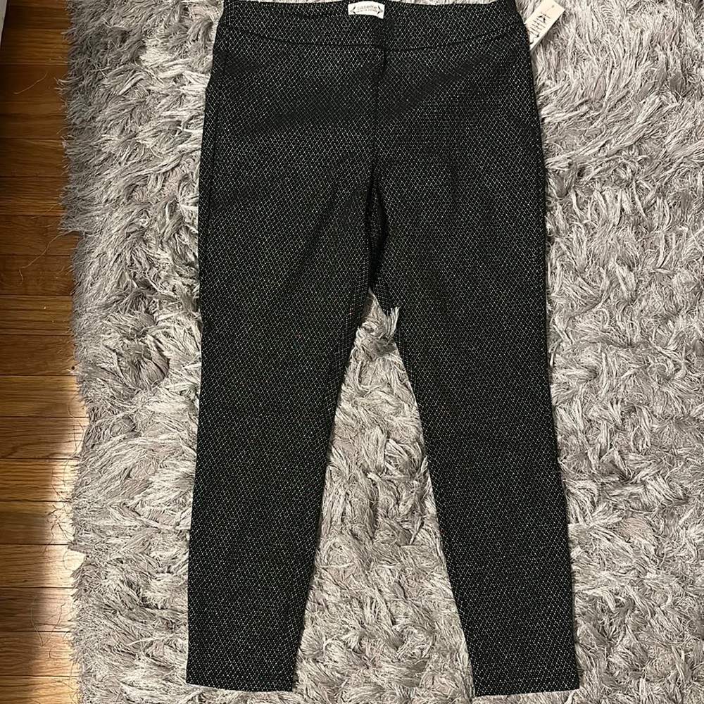 Beautiful black pants with silver accents. Size Large.  Brand new with tags.